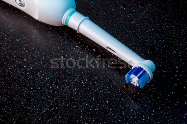 White Electric Toothbrush on Black  Stock photo © manaemedia