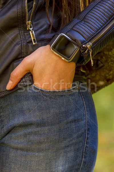 Fiatal lány okos óra érintőképernyő kéz zseb Stock fotó © manaemedia