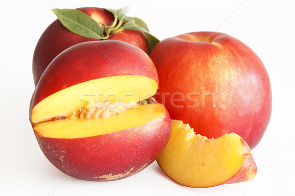 Fetta nettarine frutta sfondo arancione rosso Foto d'archivio © manaemedia