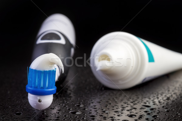 Blue toothbrush with toothpaste on black Stock photo © manaemedia