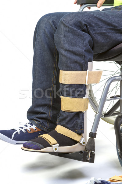 Orthopedic equipment for young man in wheelchair - close up Stock photo © manaemedia