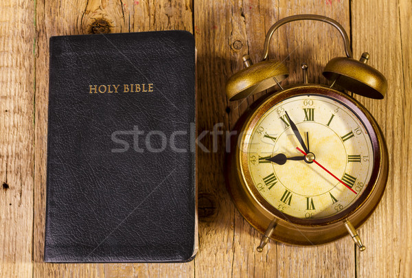 Bible with clock on wood Stock photo © manaemedia