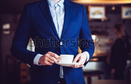 Empresario primer plano azul chaqueta taza café Foto stock © manera