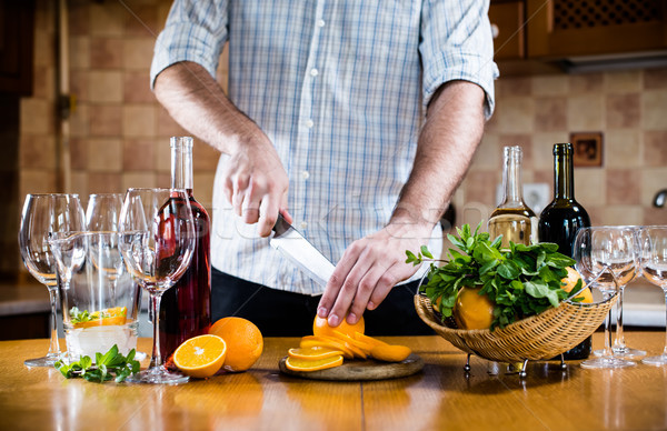 Man cuts oranges  Stock photo © manera