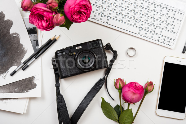 Modern smartphone, computer keyboard, pink flowers and photo cam Stock photo © manera