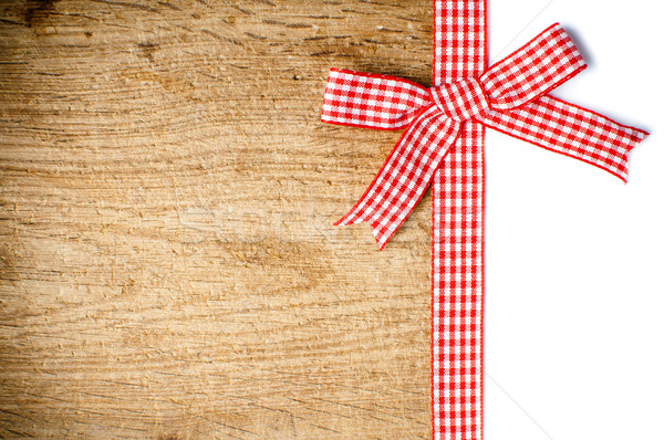 Wooden background with a red checkered ribbon Stock photo © manera