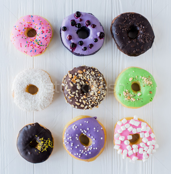 Différent coloré sweet donuts blanche peint Photo stock © manera