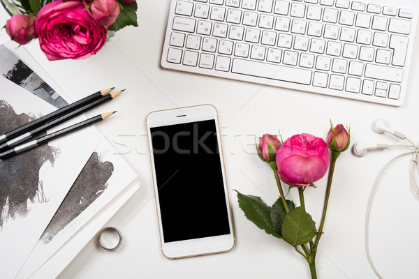 smartphone, computer keyboard and fesh pink flowers on white tab Stock photo © manera