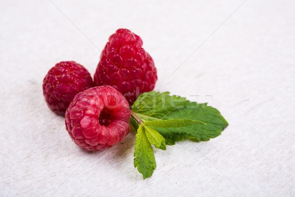 Fresh ripe raspberries on white painted board Stock photo © manera