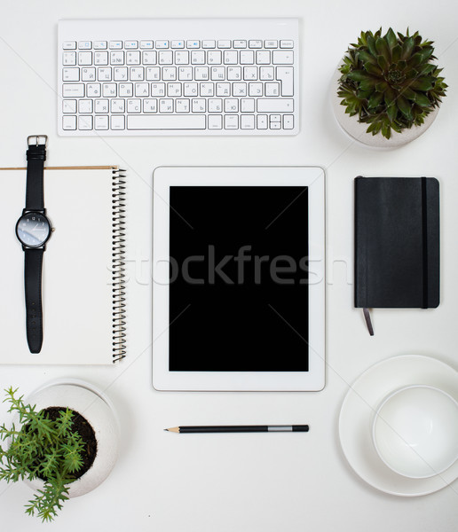 Stock photo: Tablet mock-up and office supplies on white tabletop background
