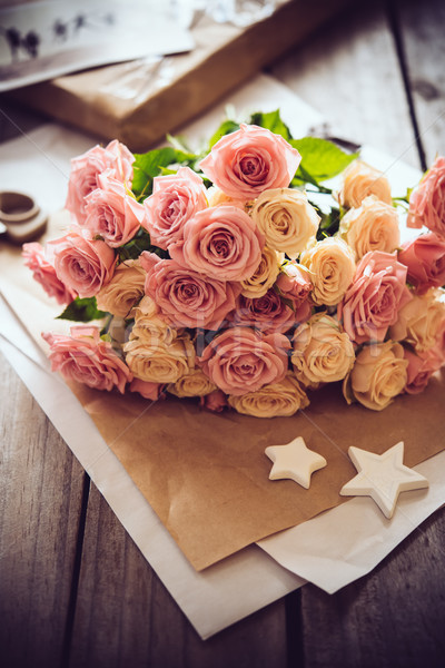 Stock photo: pink roses, craft paper