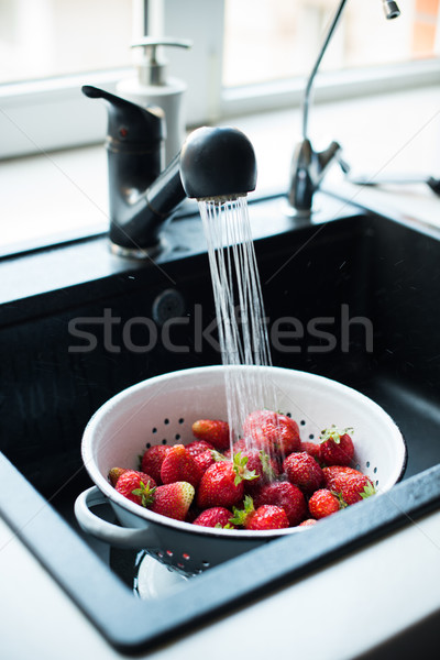 organic strawberries in colander Stock photo © manera
