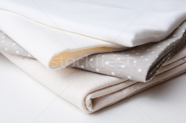 Stock photo: stack of new fabrics