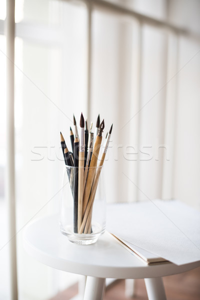 Creative artist's workspace, artistic paint brushes and paper Stock photo © manera