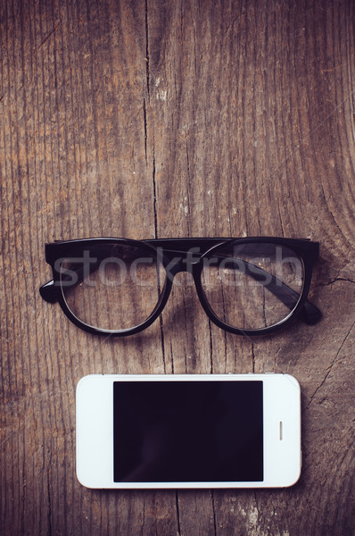 Okostelefon olvasószemüveg öreg fa deszka hipszter stílus Stock fotó © manera