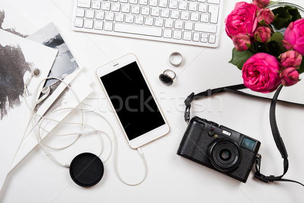Stock photo: Modern smartphone, computer keyboard and photo camera on white t