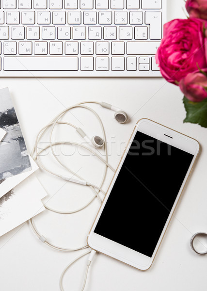 Stock photo: smartphone, computer keyboard and fesh pink flowers on white tab