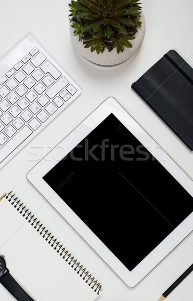 Tablet mock-up and office supplies on white tabletop background Stock photo © manera