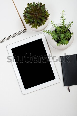 Stock photo: Tablet mock-up and office supplies on white tabletop background