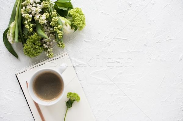 Feminine flatlay with flowers and ccoffee on white tabletop Stock photo © manera