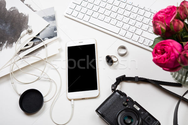 Modern smartphone, computer keyboard and photo camera on white t Stock photo © manera