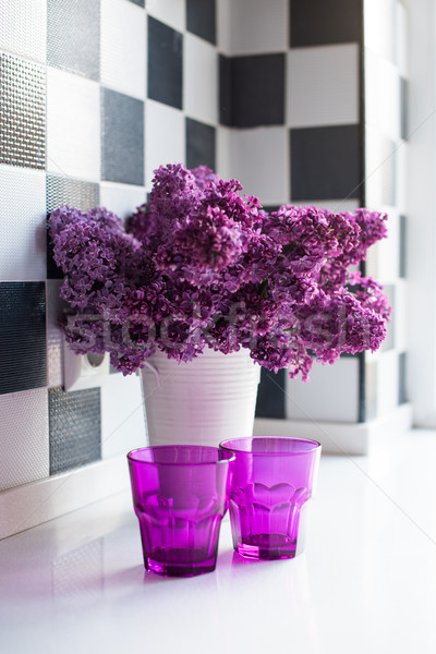 Stock photo: lilacs in a vase and glasses