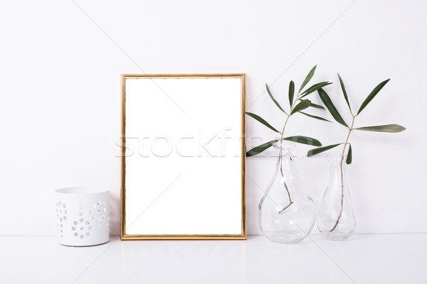 Golden frame mock-up on white wall Stock photo © manera