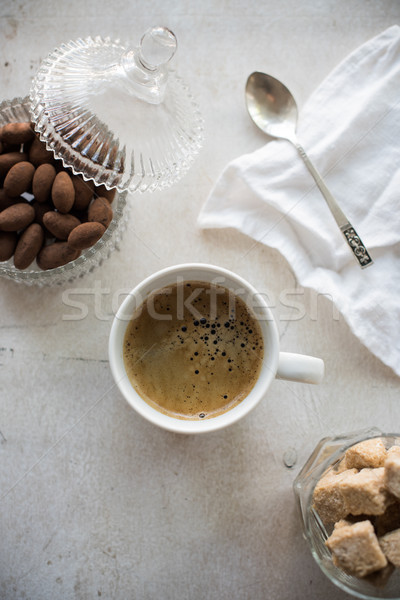 Cup of coffee, chocolates and brown sugar Stock photo © manera