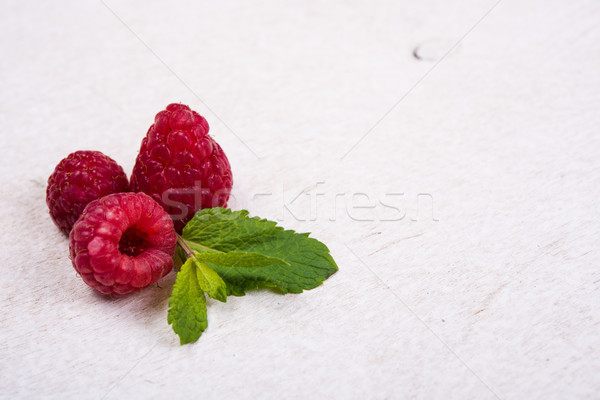 Fresh ripe raspberries on white painted board Stock photo © manera
