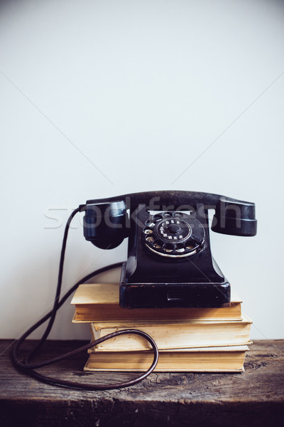 Bağbozumu telefon siyah kitaplar rustik ahşap masa Stok fotoğraf © manera