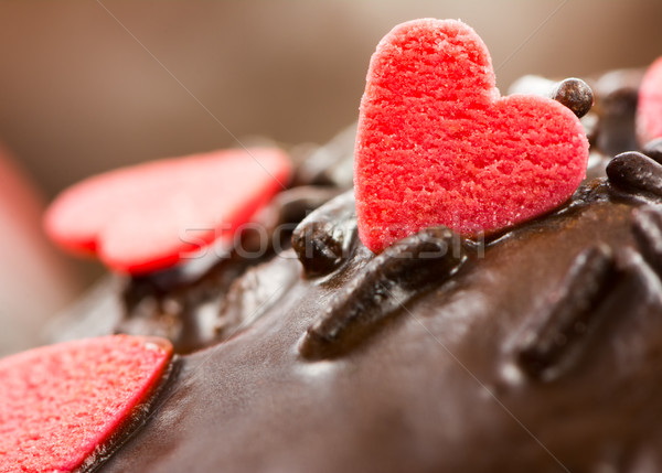 Detail of a chocolate muffin with red sugar hearts Stock photo © manfredxy