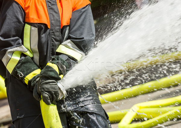Brandweerman werk water uit werken Stockfoto © manfredxy