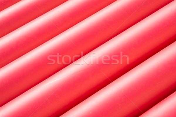 Stack of red pvc protective pipes Stock photo © manfredxy