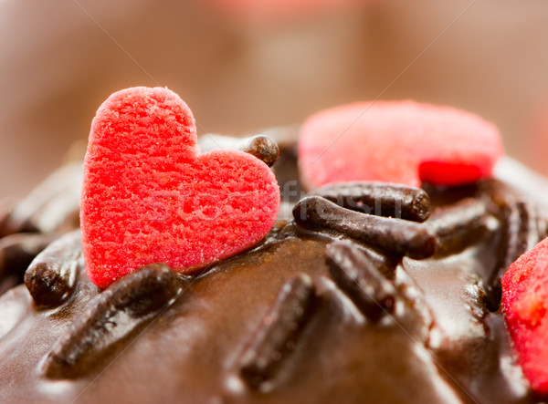 Detail of a chocolate muffin with red sugar hearts Stock photo © manfredxy