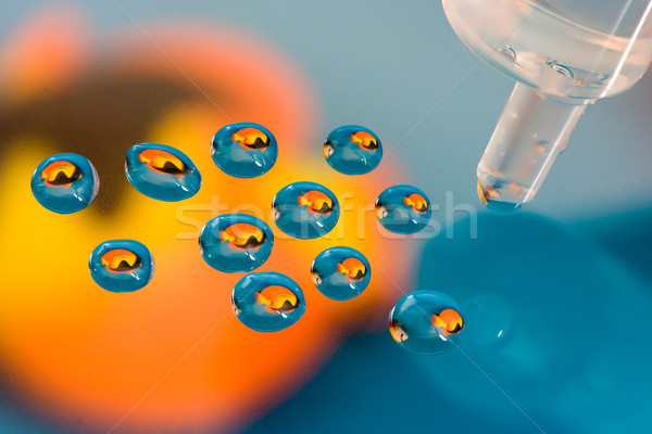 Fish reflections in a drops from a syringe Stock photo © manfredxy