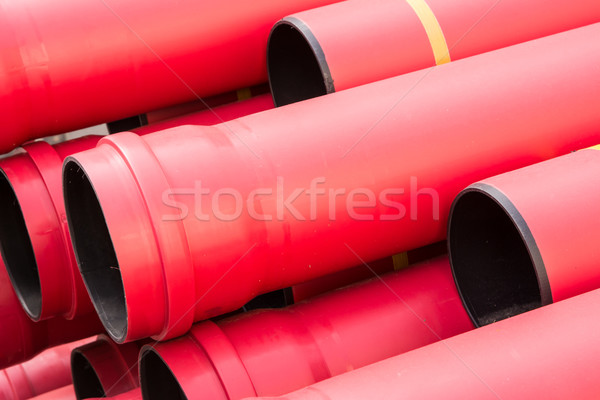 Stack of red pvc protective pipes Stock photo © manfredxy