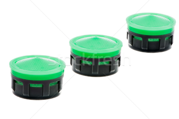 Row of isolated plastic faucet aerators Stock photo © manfredxy