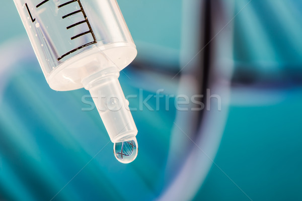 DNA reflection in a drop from a syringe Stock photo © manfredxy