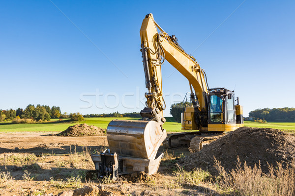 Yellow earth mover at a construction site Stock photo © manfredxy