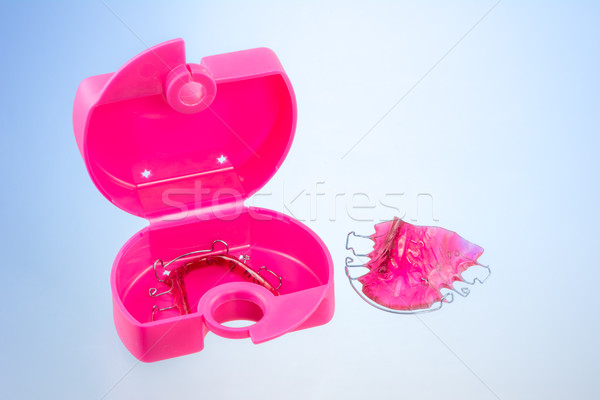 Stock photo: Dental braces and a plastic box