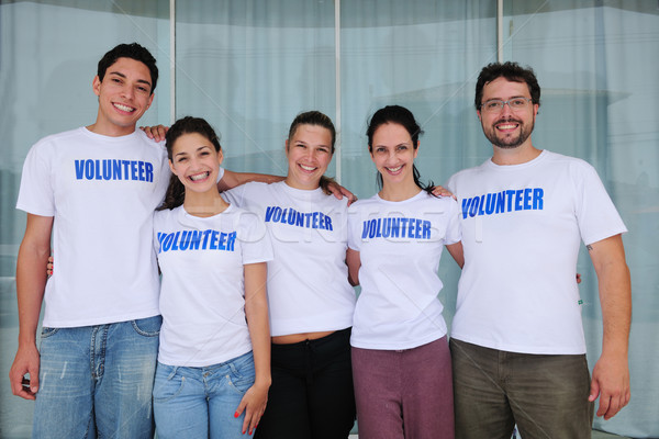 happy and cheerful volunteer group Stock photo © mangostock
