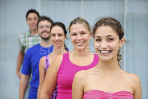 group of casual real people, teenage girl in front Stock photo © mangostock