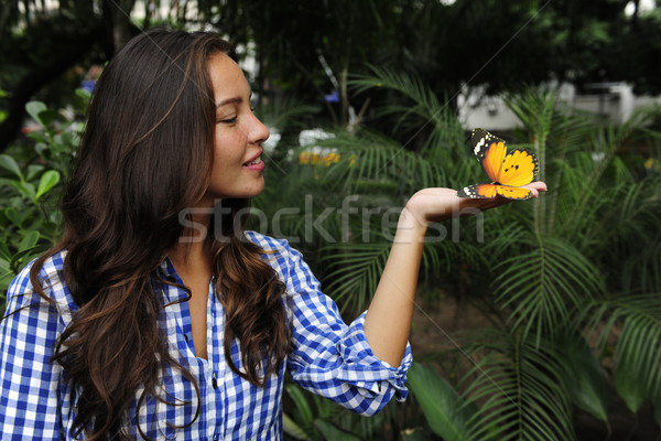 Stock fotó: Pillangó · ül · kéz · fiatal · nő · erdő · lány