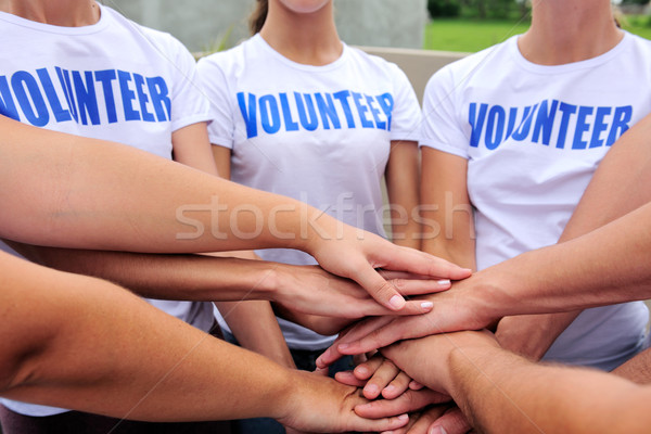 önkéntes csoport kezek együtt mutat egység Stock fotó © mangostock