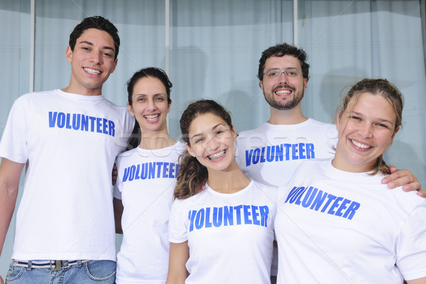 happy and cheerful volunteer group Stock photo © mangostock