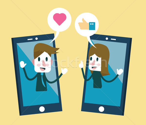 Man and woman sending stickers on smartphone. Stock photo © mangsaab