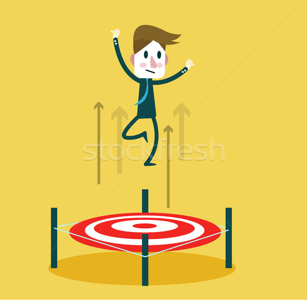 Stock photo: Businessman jumping up by Bullseye. 