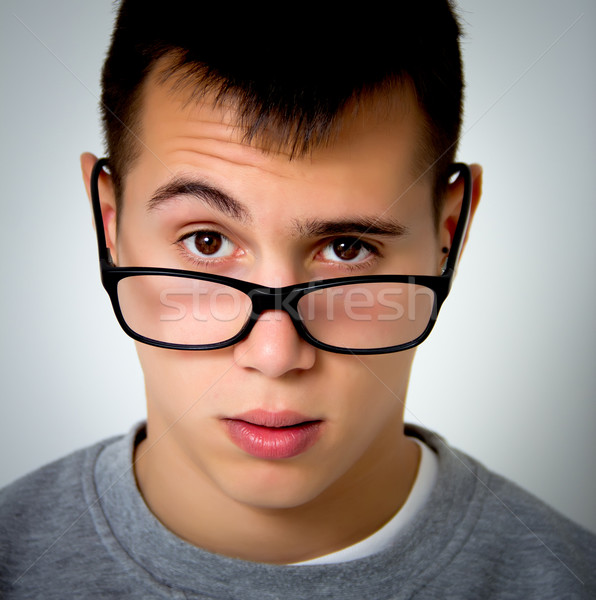 Teenager Porträt junger Mann Gläser Lächeln Gesicht Stock foto © Marcogovel