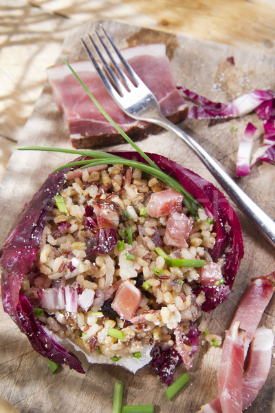 Brown rice with red radicchio and speck Stock photo © marcoguidiph