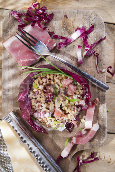 Brown rice with red radicchio and speck Stock photo © marcoguidiph